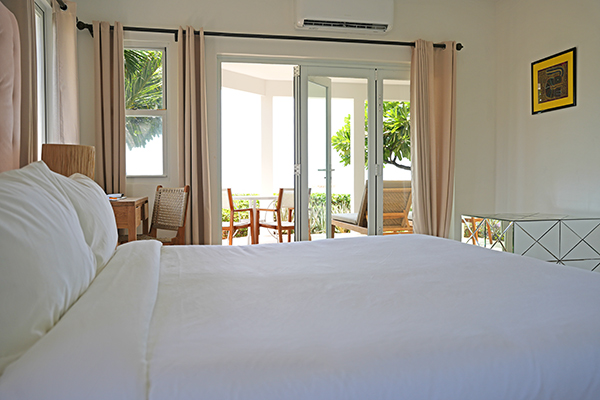 Superior Beachfront Suite bedroom at Manoah Boutique Hotel Anguilla