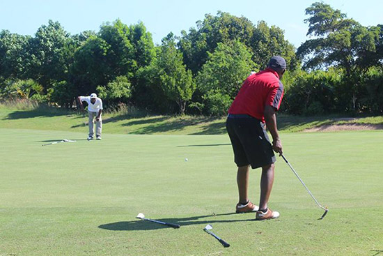 working on the short game at the anguilla golf tournament