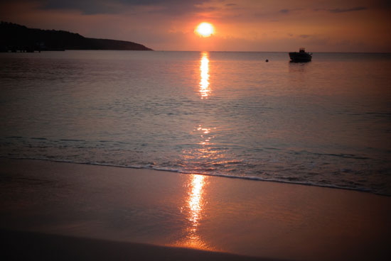 sunset over sandy ground