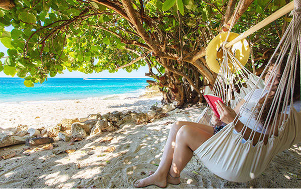 Relaxing on the beach Sandcastle Beach House