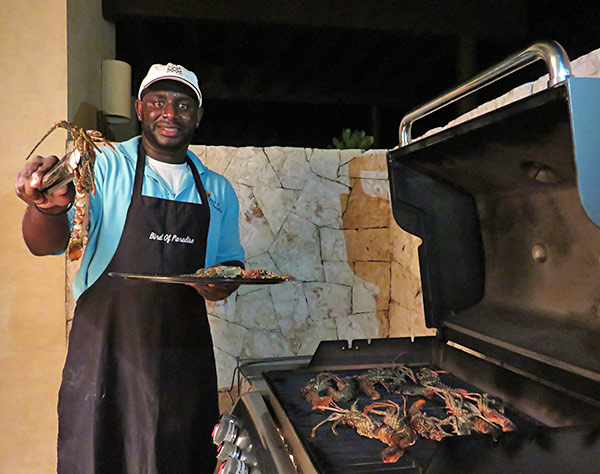 chef kylon grilling crayfish at bird of paradise villa