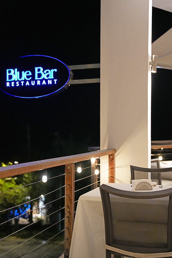 Dining table overlooking the sea at Blue Bar at CéBlue