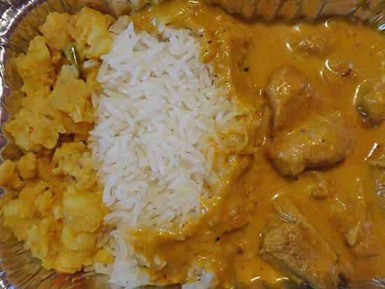 chicken korma meal with rice and potato