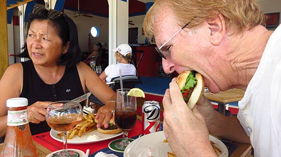 dad biting into the burger