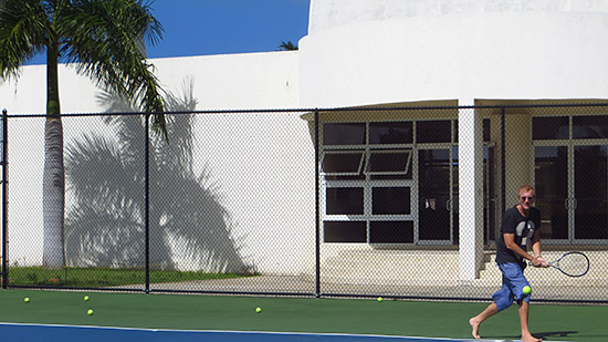 tennis academy dad playing