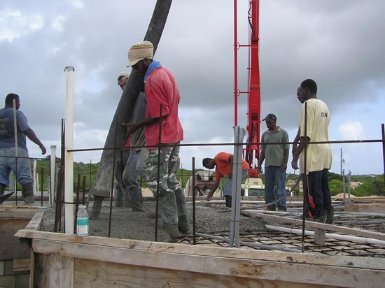 The First Team Places And Vibrates The Concrete