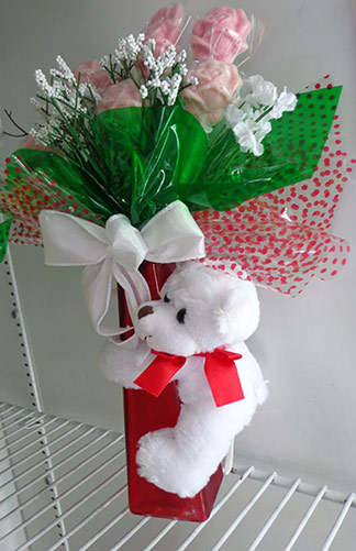 flowers with teddy bear from the gift box