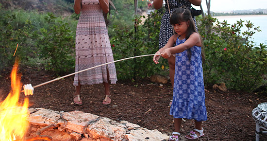 kids roasting marshmallows at malliouhana