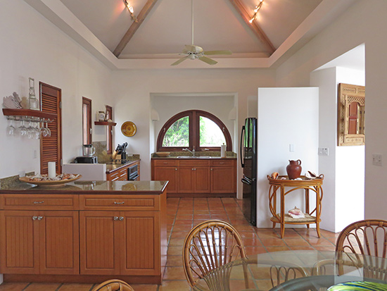 kitchen and dining area inside beach palm at twin palms villas