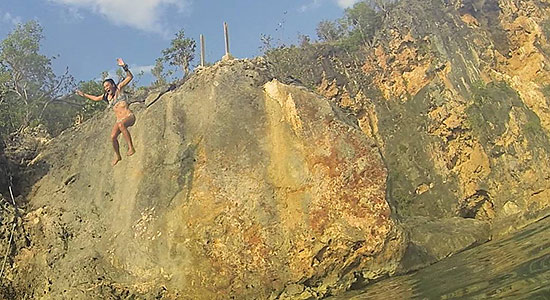 jumping off of the rock in little bay