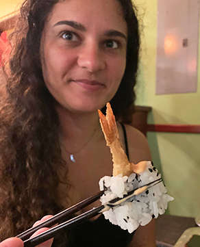 Louise Enjoying Her Favorite Tempura Roll at Oishi