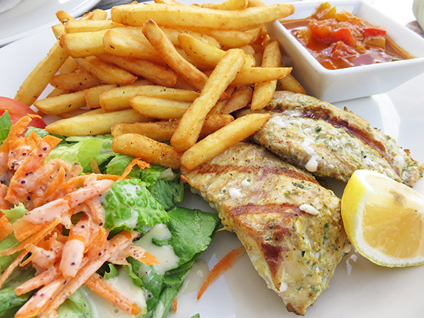 Grilled fish, fries and salad