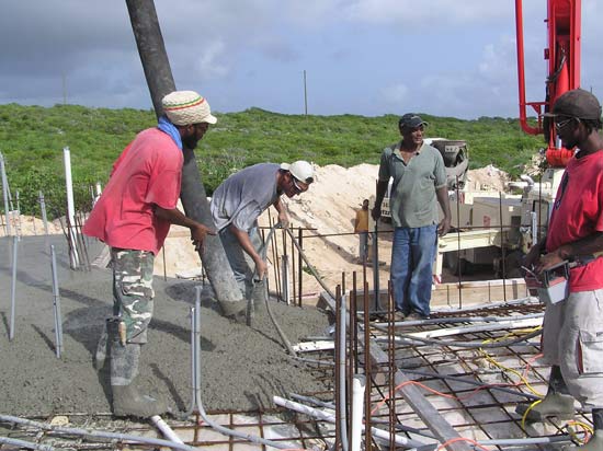 Mike Vibrating Concrete Into The Block Holes