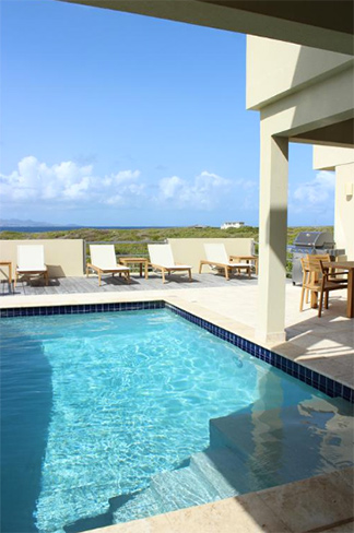 outdoor living space with pool at moondance villa