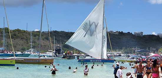 sailboats departing sandy ground