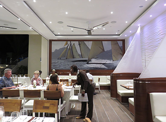the dining room lay out inside the yacht club at the reef