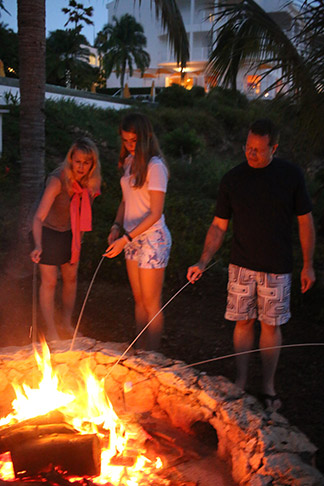 roasting marshmallows on an open fire