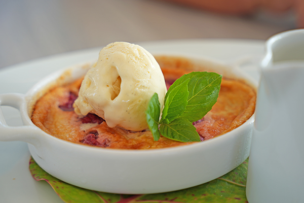 Raspberry Clafoutis with vanilla ice cream and white chocolate sauce.