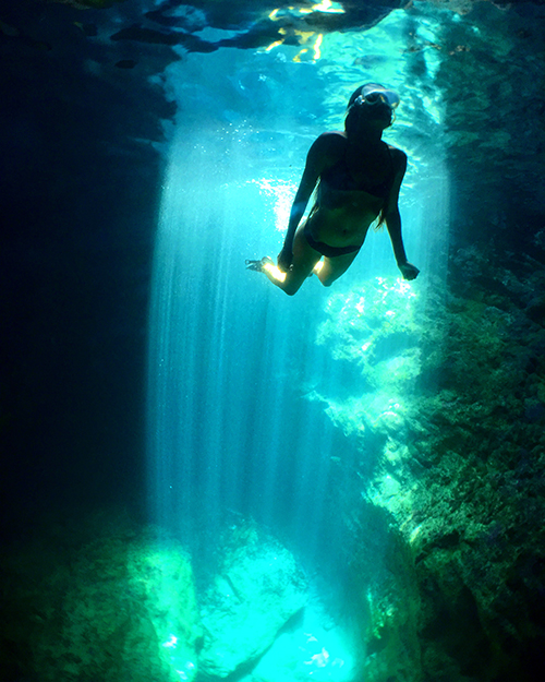 rays of light inside the sea cave at scrub island