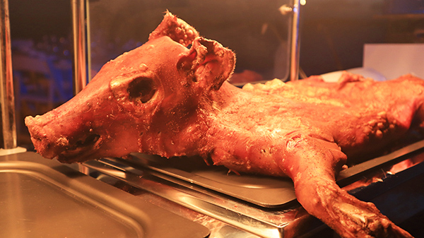 Roasted pig at Beach BBQ Buffet At Belmond Cap Juluca