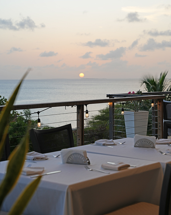 Sunset view from Blue Bar at CéBlue overlooking Crocus Bay