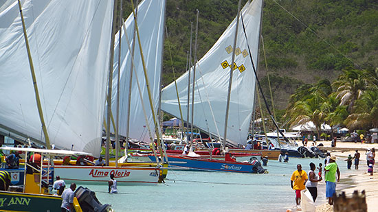 sailboats departing sandy ground