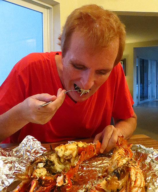 dad digging into the lobster