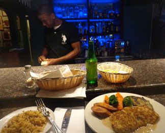 at the bar at tasty's caribbean restaurant in anguilla