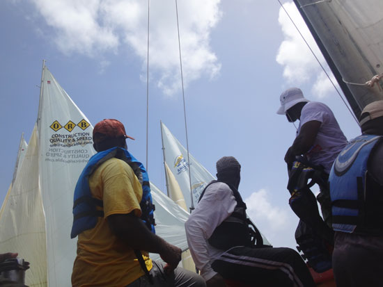 view from down inside the boat as the sail boat race gets underway