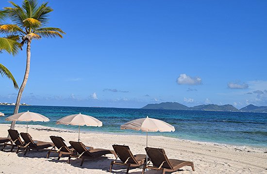 beach chaises on beach at the reef anguilla