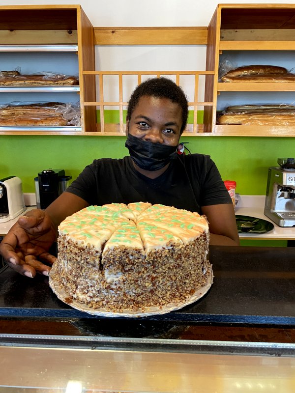 Aleda with a cheese cake at chef's bakery