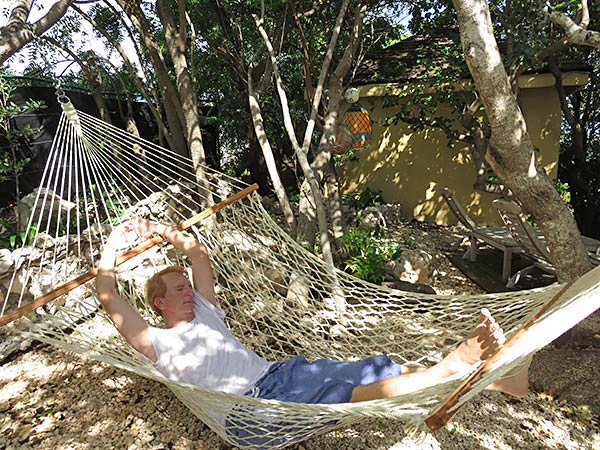 dad lounging in the luxury villa's hammock