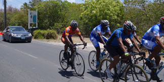 driving in Anguilla, roundabout, cyclists