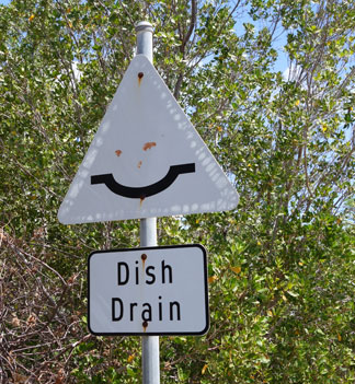 driving in Anguilla, dish drain, road sign