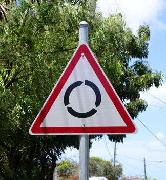 driving in Anguilla, roundabout, road sign