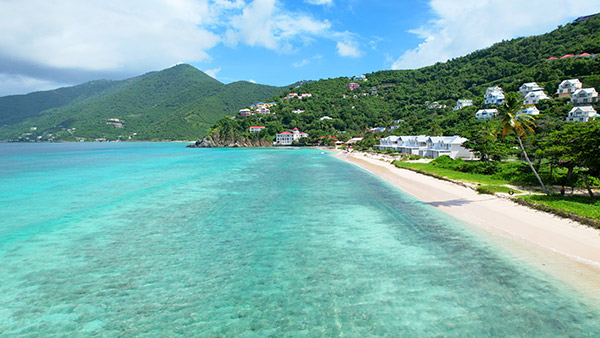 the beach setting at long bay beach resort