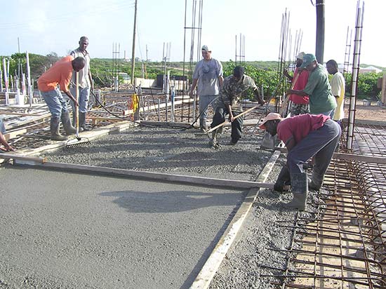The First Team Places And Vibrates The Concrete