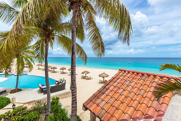 pool and beach at frangipani