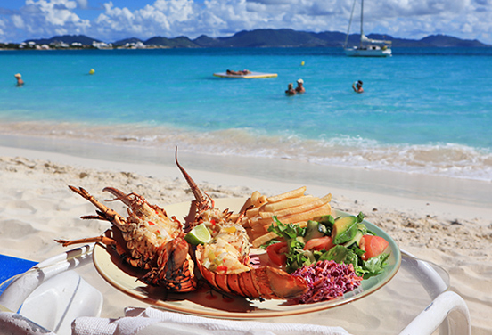 Grilled lobster and fries from Sunshine Shack beachbar N Grill