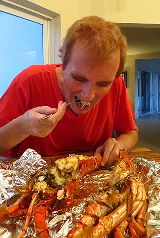 dad digging into lobster