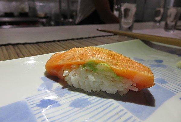 lightly seared salmon sushi with charcoal salt in anguilla