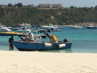 fishermen returning with lionfish catch in anguilla