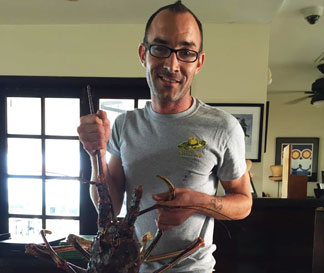 chef nick dellinger with lionfish catch