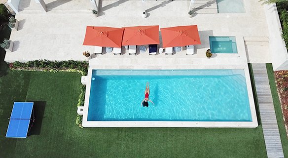 Louise floating in pool at Champagne Shores