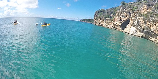 the towering cliffs that surround little bay anguilla