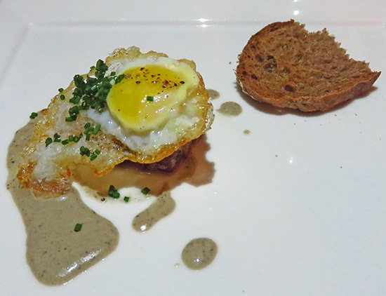 quail egg with edwards farm bacon and country bread