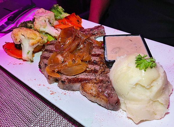 Ribeye Steak with Mushroom Sauce at Movida Rotisserie & Grill