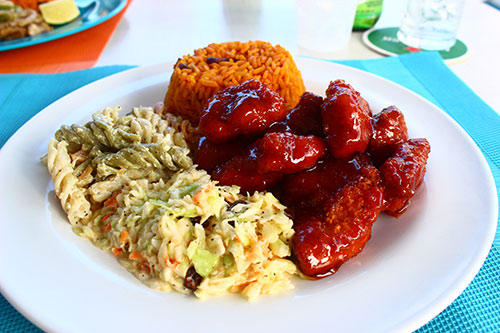 sweet and spicy chicken with rice and peas and pasta salad at sharpys