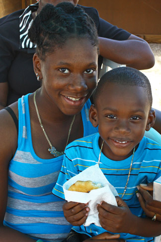  Partakers sharing a fried Johnny Cake