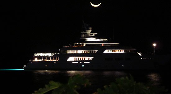 yacht and moon seen from malliouhana in meads bay